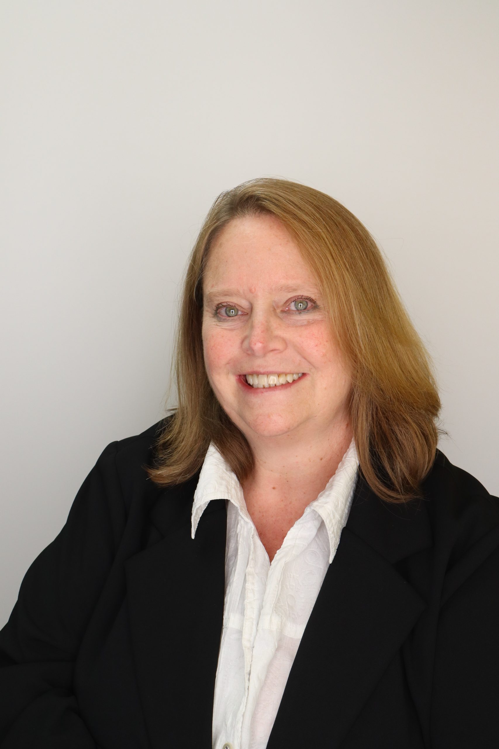 Female w/ white shirt and black jacket